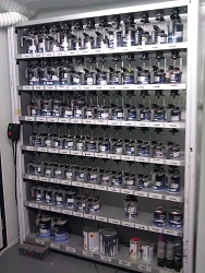 Racks of paint tins in the Scotspray mixing room