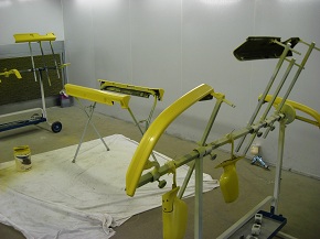Freshly painted parts drying in the booth