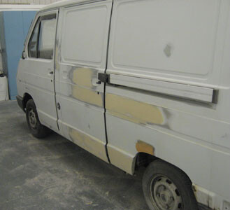 Van in primer during repairs