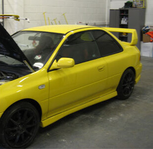 Subaru Impreza in yellow, side view
