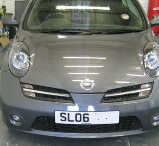 Grey Nissan Micra front end